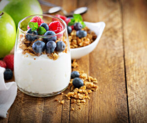 Cottage cheese and yogurt parfait with granola and fresh berry