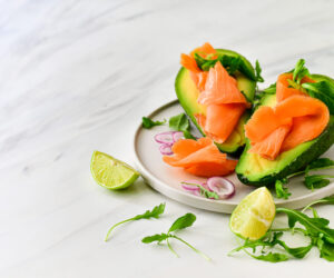keto diet food : salmon and avocado  with arugula and lime. heal