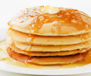 pancakes topped with honey